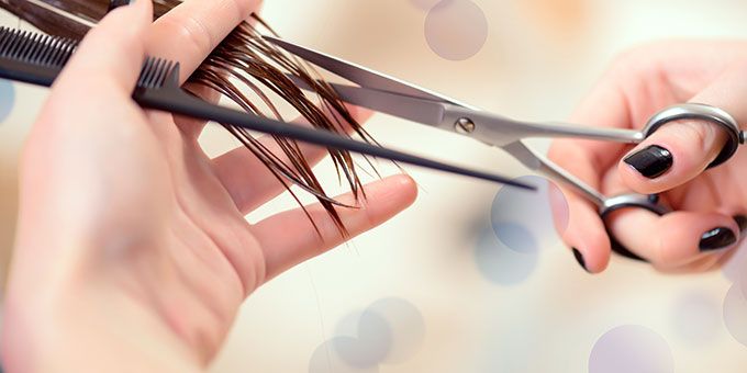 Hairdresser cutting hair at Sydney best salon