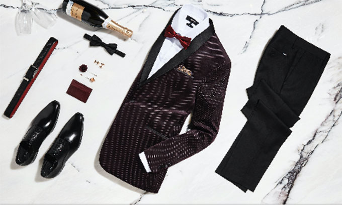 Velvet tux jackets and luxe suit accessories make a big statement for mens wedding attire.