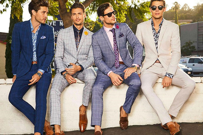 Checked suits and light tailoring make a cool impact for mens wedding suits.
